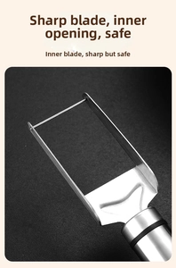 Close-up of stainless steel dual-head watermelon cutter with sharp U-shaped blade