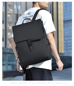 Outdoor shot of a black business backpack with metal buckle for daily commute
