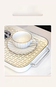 Close-up of a white rectangular double-layer drainage tray with silver metal handles