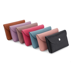 Mini soft leather coin purses in various colors with secure metal snap buttons