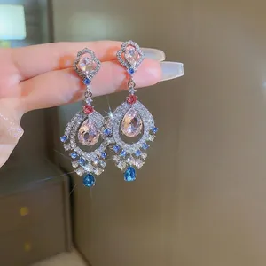 Vintage palace style teardrop earrings with pink and blue zircons in silver finish