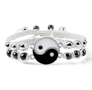 Detail of adjustable Yin Yang charm bracelet with black and white enamel and metal beads