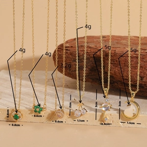 Gold necklaces set featuring emerald and zircon pendants like rabbit and cherry charms