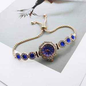 Elegant gold quartz watch with blue stones and adjustable drawstring bracelet