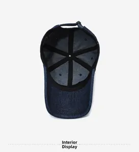 Inside view of navy denim baseball cap showing black inner lining and adjustable metal buckle