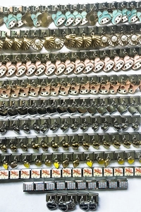 Detailed macro view of DIY stainless steel Italian charm bracelets with colorful enamel icons