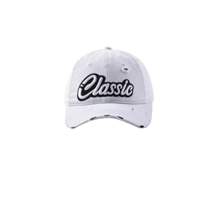 Close-up of white distressed baseball cap featuring black 3D Classic embroidery