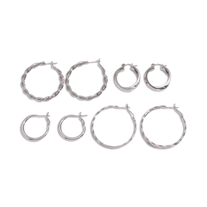 Eight-piece set of minimalist silver geometric hoop earrings in various twisted designs