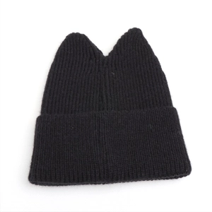 Detail showing the cat ear design on a black ribbed knit beanie for winter