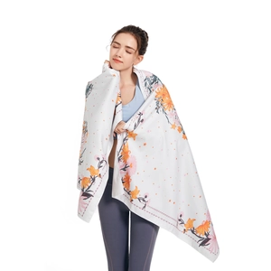 Microfiber beach towel with orange and pink floral print for sports and swimming