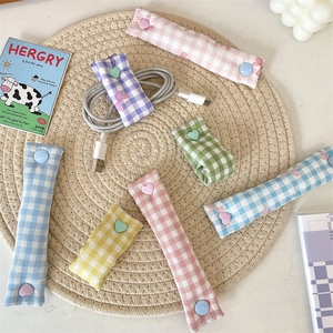 Cute plaid fabric cable organizers with heart buttons for neat USB wire storage