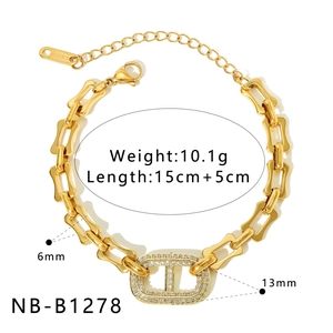 Detail view of gold-plated stainless steel chain with zircon-studded oval charm and specs