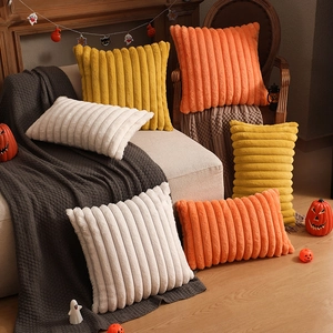 Striped plush bunny fur pillows in orange and yellow for Halloween home decor