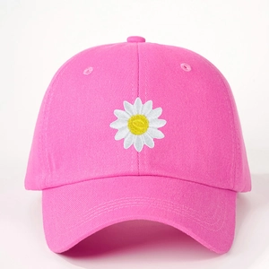 Vibrant pink baseball cap with white daisy embroidery and adjustable cotton strap