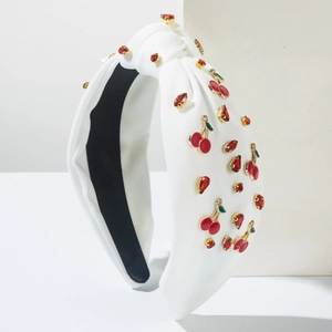 Serre-tête blanc noué avec motifs cerises et strass rouges pour un style élégant