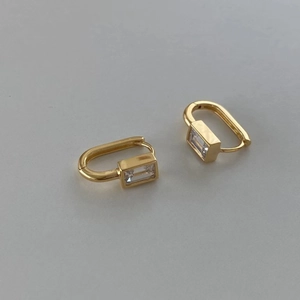 Minimalist rectangular gold-plated silver earrings with step-cut cubic zirconia studs
