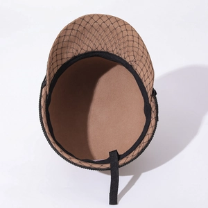 Detailed close-up showing the interior and black mesh netting of this wool felt newsboy hat