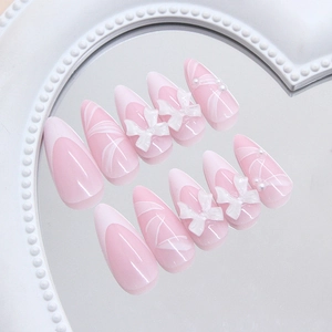 French style long almond press-on nails with 3D bows, pearls and white wave design