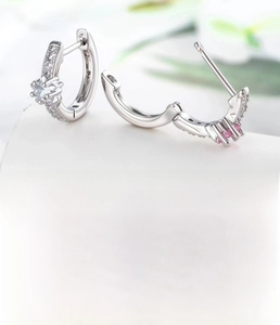Detailed view of silver hoop earrings featuring star zircon and 10mm inner diameter