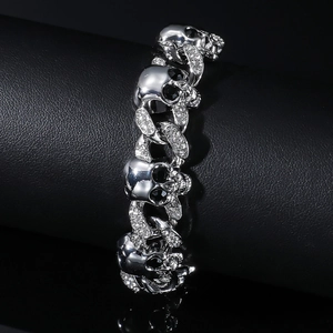 Fashion silver skull link necklace with black rhinestone eyes on black leather background