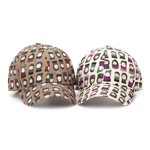 Close-up of two baseball caps featuring unique all-over cartoon character prints