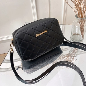 Chic black quilted camera crossbody bag with diamond patterns and golden metallic accents