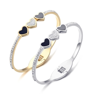 Bracciali a cuore aperto in acciaio al titanio oro e argento con pavé di cristalli luce