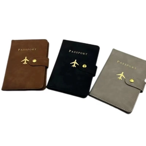 Three RFID passport holders in brown black and gray with gold airplane icons