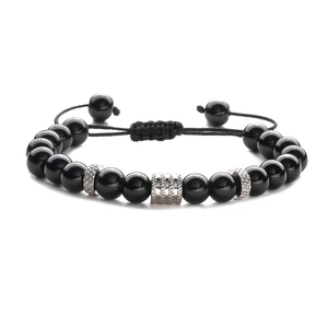 Detail of adjustable beaded bracelet with polished black agate beads and silver metal spacers