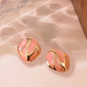 Vintage irregular square gold studs with salmon pink marble enamel texture in soft light