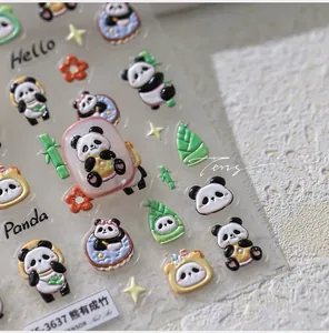Detail view of 3D panda and bamboo nail art stickers with embossed texture and floral accents