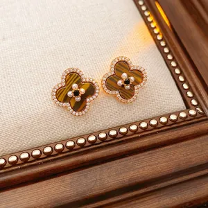 Vintage gold clover earrings with tiger eye texture, pearls and sparkling crystals