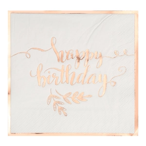 Detail of white paper napkin with rose gold happy birthday text and embossed edges