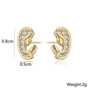 Macro shot of 18K gold plated fish stud earrings with size details 0.8cm by 0.5cm