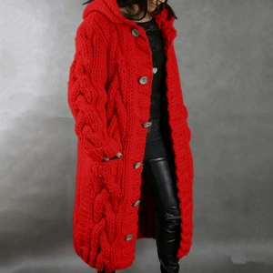 Detailed close-up of chunky red cable knit hooded cardigan with large buttons