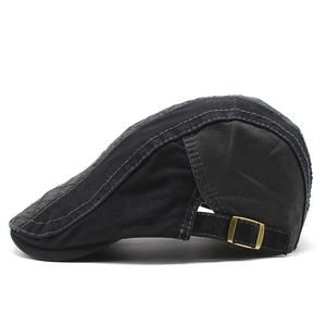 Black cotton newsboy cap with vintage metal side buckle and rugged contrast stitching