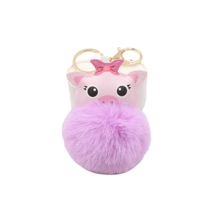 Cute pink pig keychain with large purple fluffy pompom and gold metal ring hardware