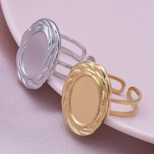 Minimalist oval signet rings in gold and silver steel with textured woven borders