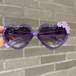 Sparkly purple heart-shaped sunglasses for kids with floral accents and glitter frames
