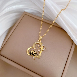 Gold panda bamboo heart pendant necklace with shimmering cubic zirconia crystals