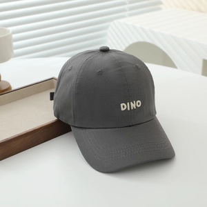 Detail of grey kids baseball cap with DINO embroidery and durable reinforced stitching