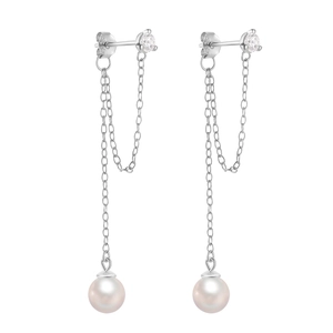 Detailed macro view of S925 silver chain fringe earrings with pearls and zircon studs
