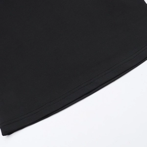 Detailed macro shot of the black knitted fabric showing precision double-needle hem stitching