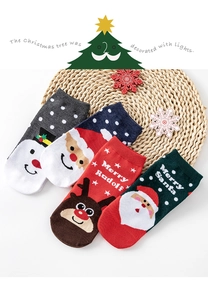 Detail of four-pair cotton Christmas socks featuring snowman, Santa and reindeer patterns
