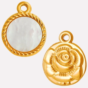 Detail of gold pendant showing white shell inlay and 3D rose flower carving