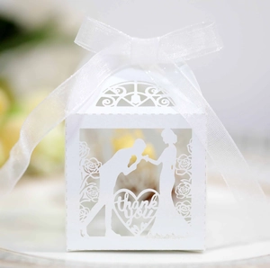 Detailed laser-cut heart candy box with romantic silhouette and white ribbon accents