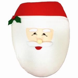 Detail of Santa Claus toilet lid cover with red hat, white beard and holly berry leaf