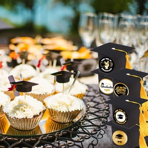 Mini graduation cap cupcake toppers and gift boxes with yellow tassels for party favors