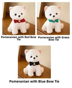 Detailed plush Pomeranian toys featuring red, green and blue bowties on wooden surface