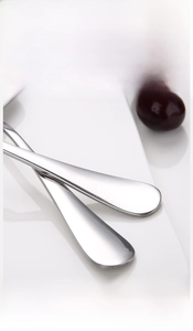 Close-up of polished thick stainless steel ice tong with smooth rounded edges